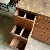 Craftsman's cabinet with 16 drawers in dark wood.