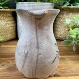 Vintage grey ceramic pitcher with hand-painted blue flower decoration.