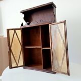 Small antique wall cabinet in Gothic style.