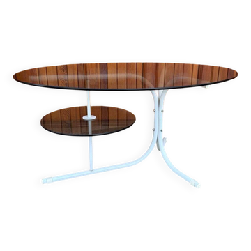 Oval smoked grey glass coffee table with white metal legs - 1990s vintage style.
