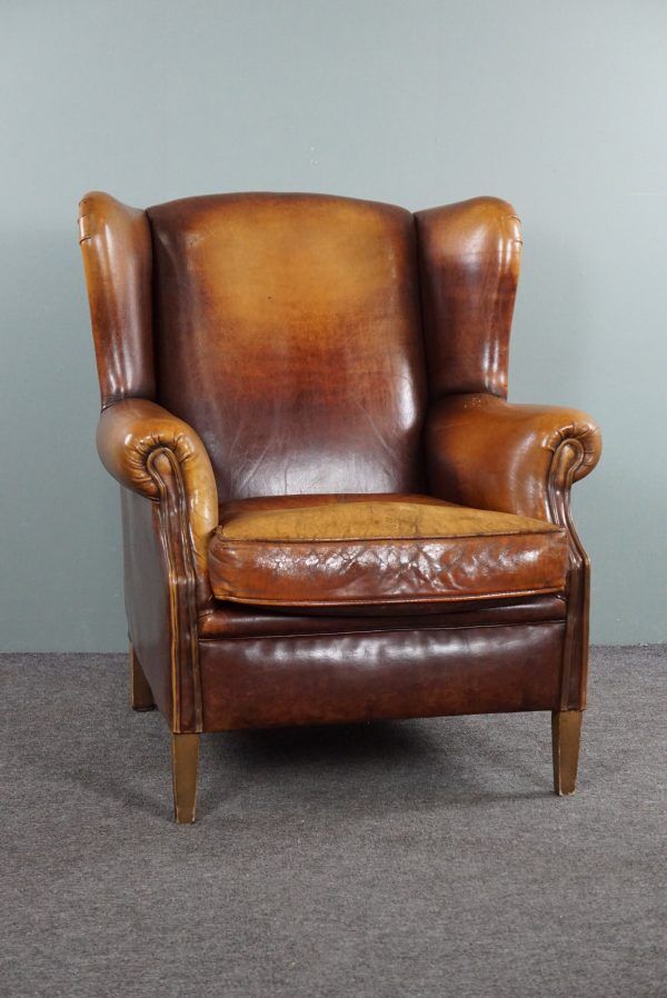 Armchair in patinated sheepskin leather