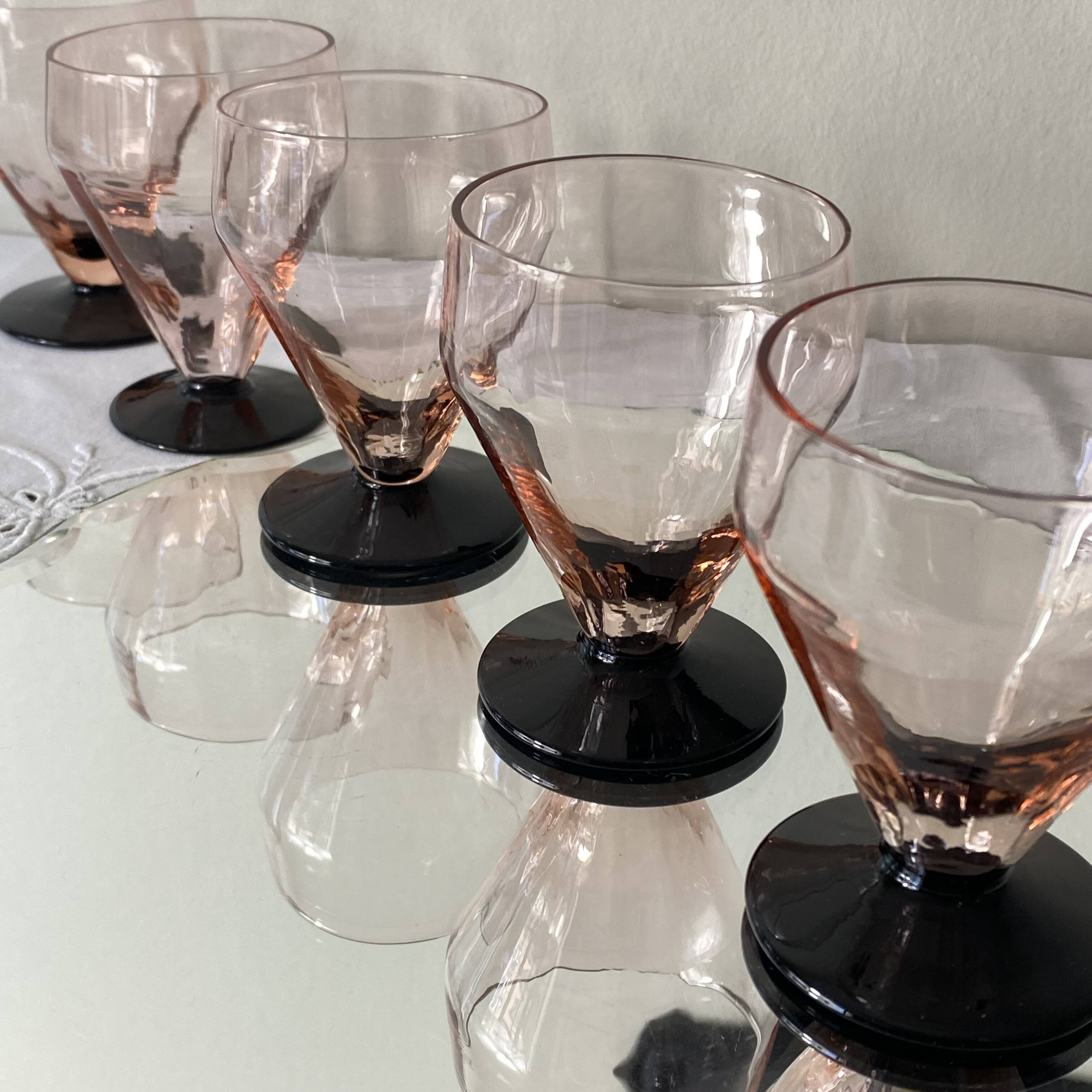 6 small Art Deco pink wine or water glasses with black stems.