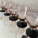 6 small Art Deco pink wine or water glasses with black stems.