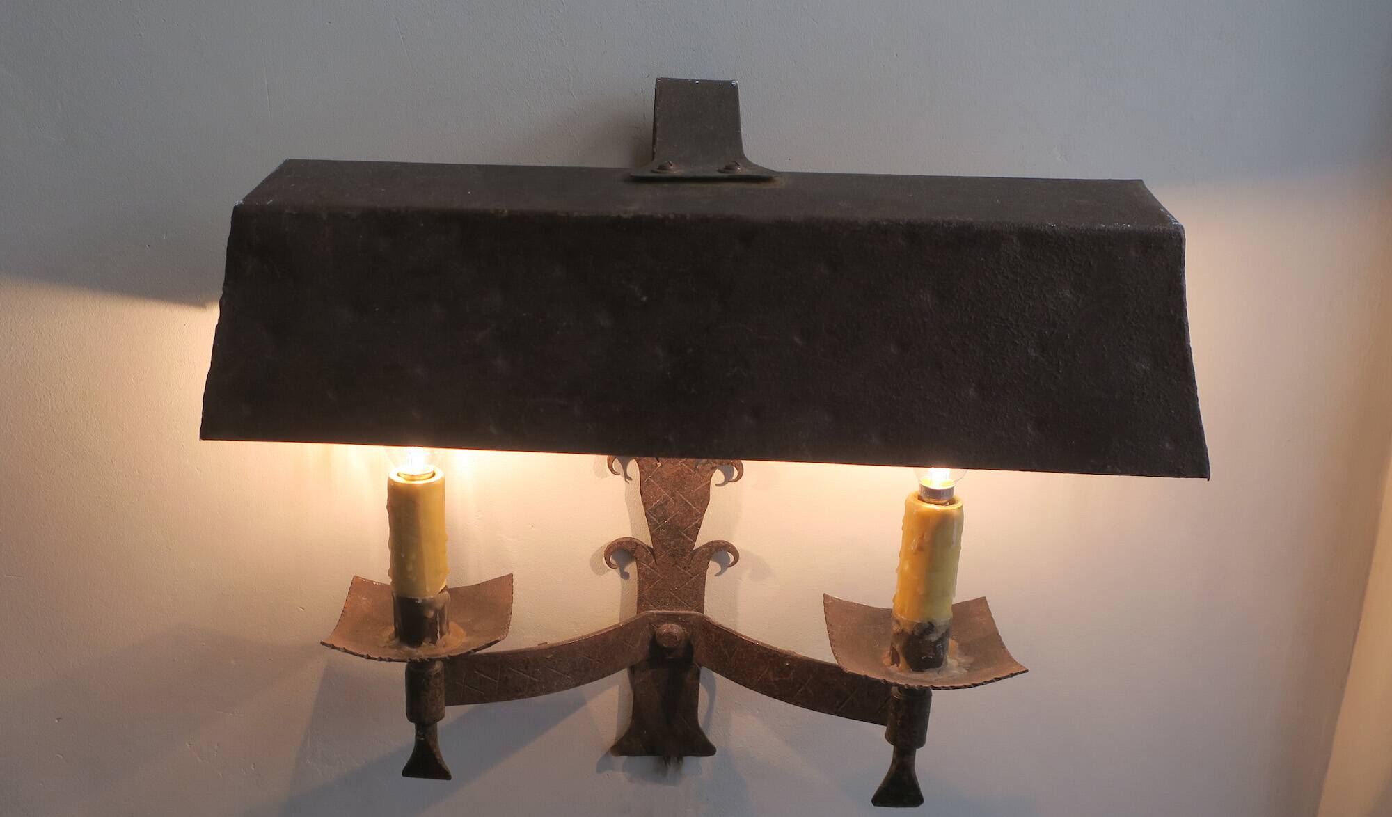 Pair of mid century Brutalist patinated iron wall lights, 1950s-60s