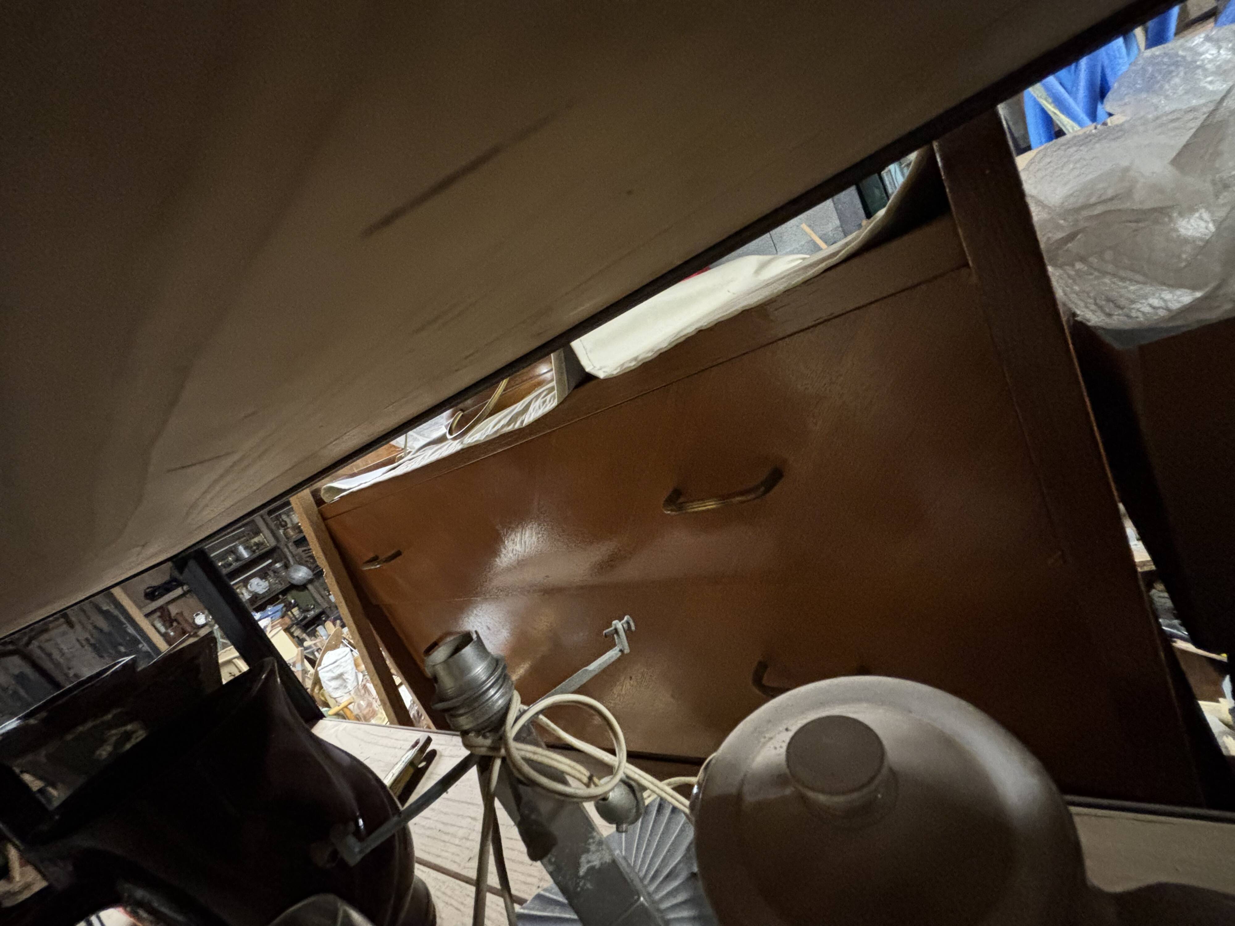 Vintage chest of drawers with compass feet.