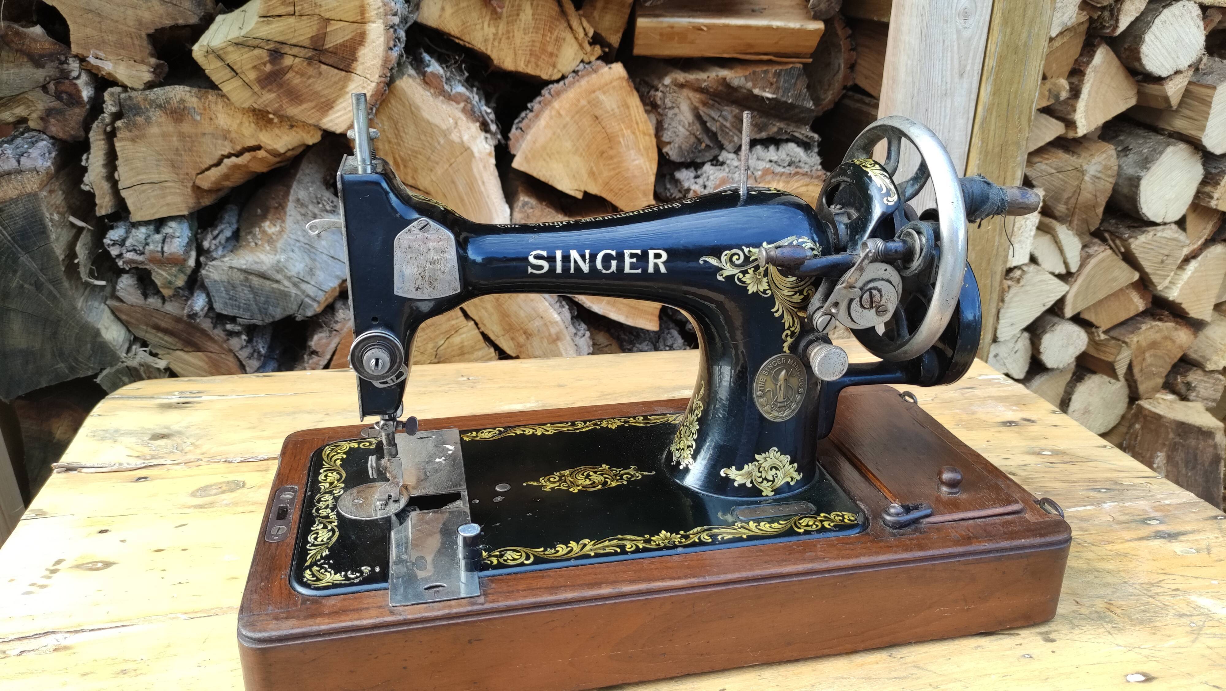 Old Singer sewing machine on its original base