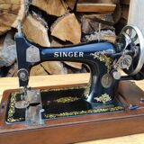 Old Singer sewing machine on its original base