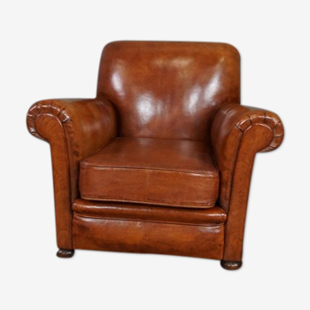 Newly upholstered antique leather armchair