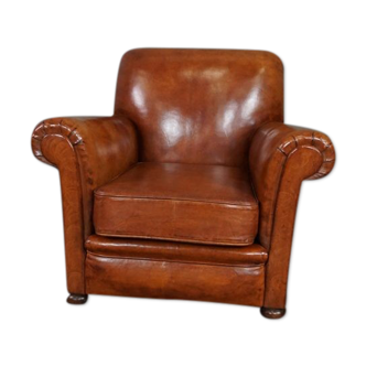 Fauteuil en cuir ancien nouvellement rembourré