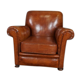 Newly upholstered antique leather armchair