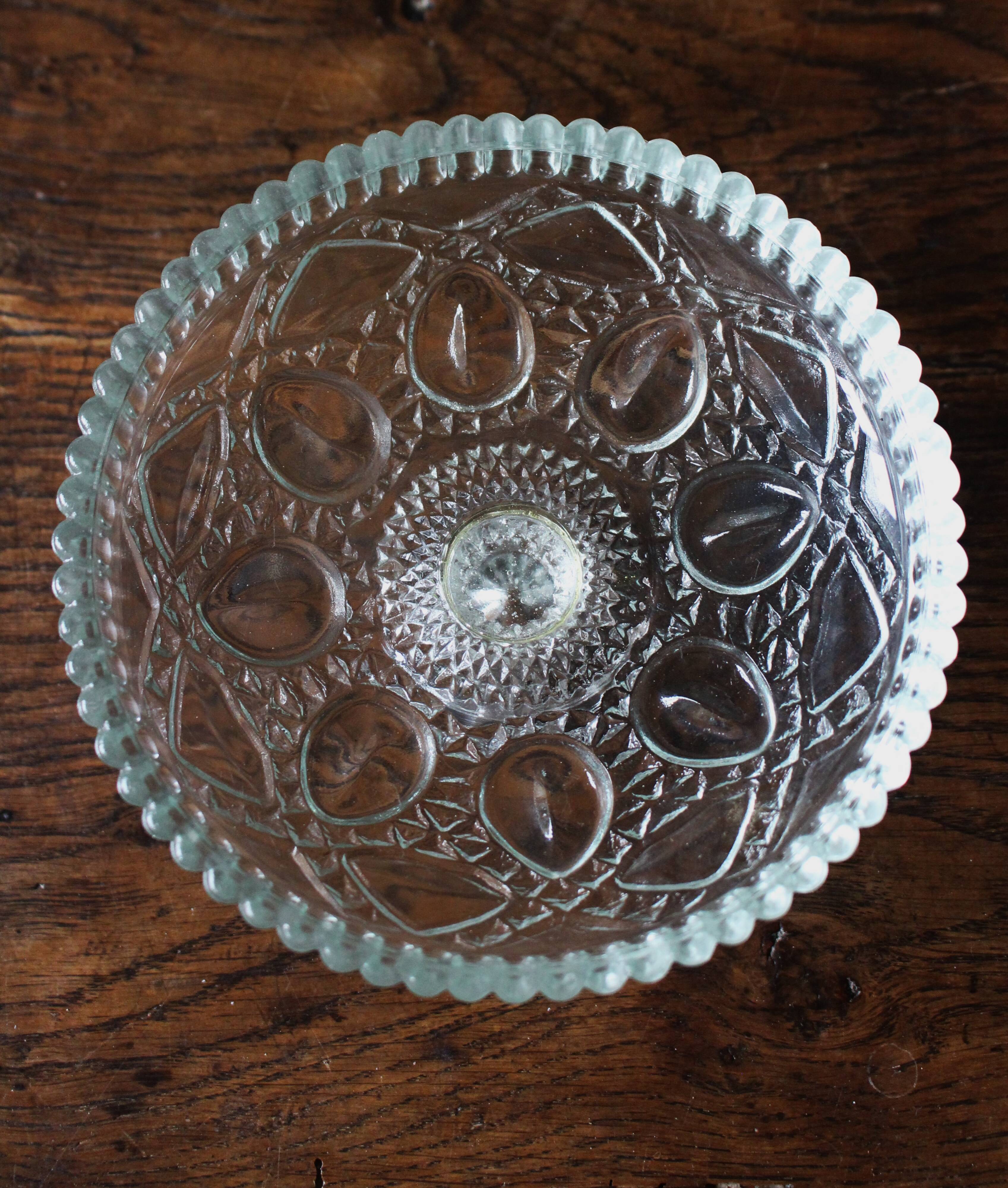 Cut glass goblet with a transparent stem.