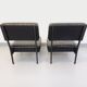 Set of 2 vintage modernist armchairs in black faux leather and metal.