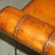 Vintage Spanish window bench in hand-stitched leather and restored iron.