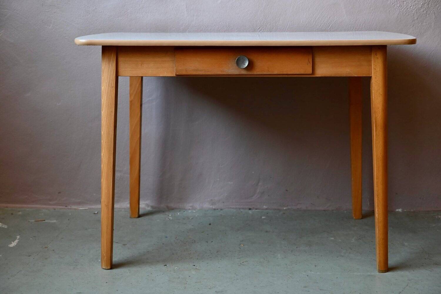1950s Formica kitchen table with tapered legs and vintage drawer.