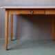1950s Formica kitchen table with tapered legs and vintage drawer.