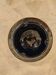 Small vintage ashtray in black ceramic with gold decoration in Greek style.