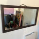 Large vintage mirror with a carved solid wood frame.