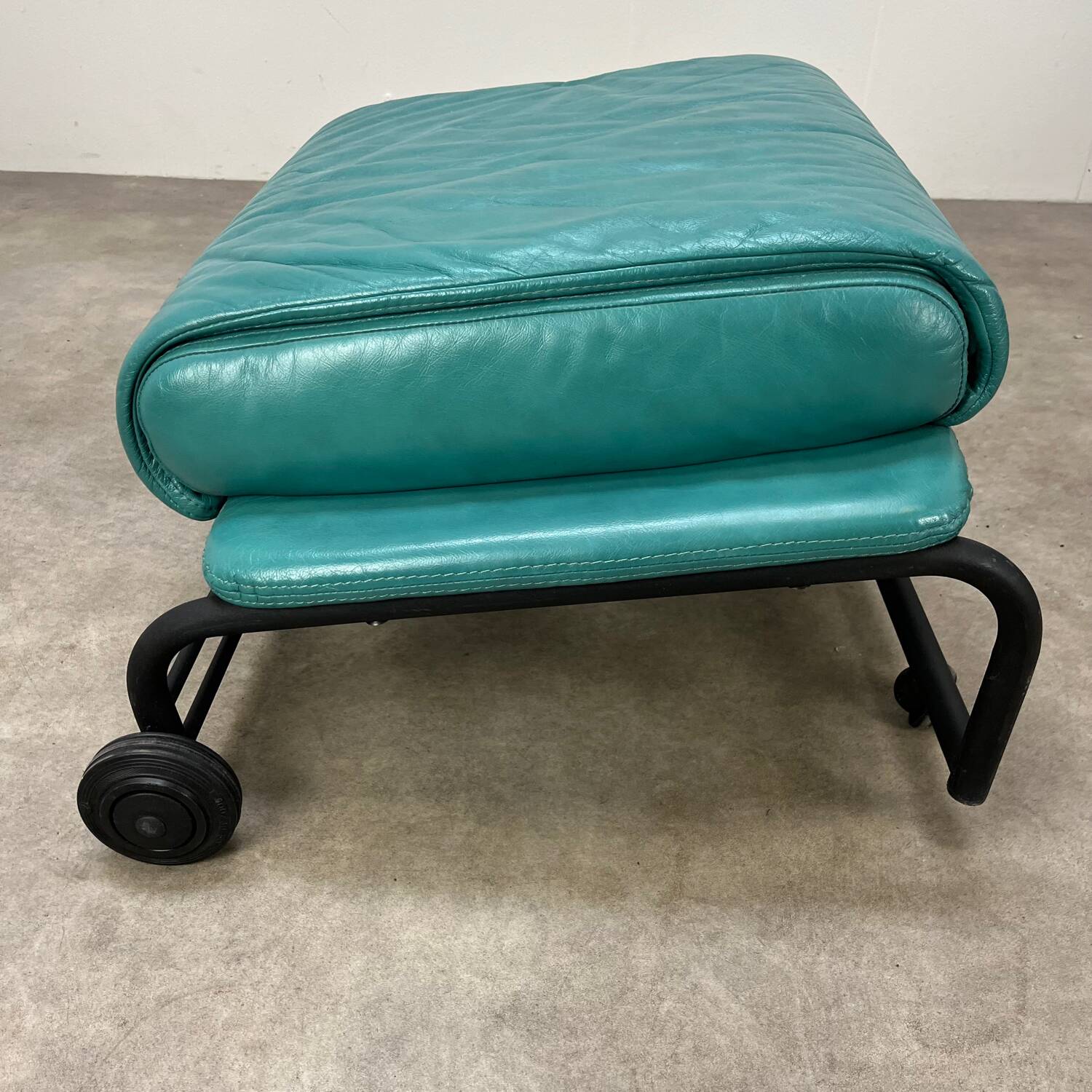 Postmodern design armchair and ottoman, 80s leather