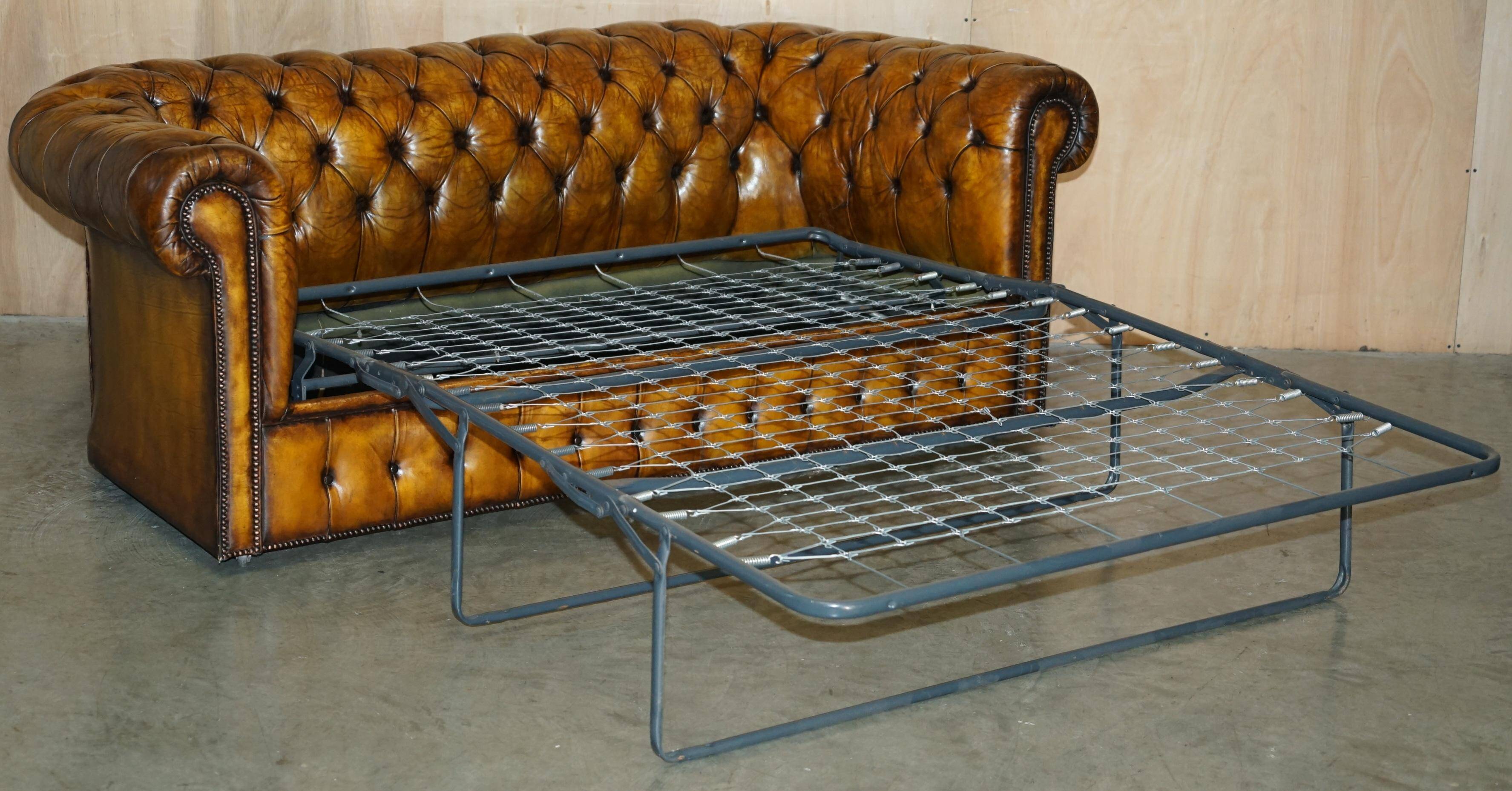 Vintage Chesterfield leather sofa bed, fully restored, circa 1940.