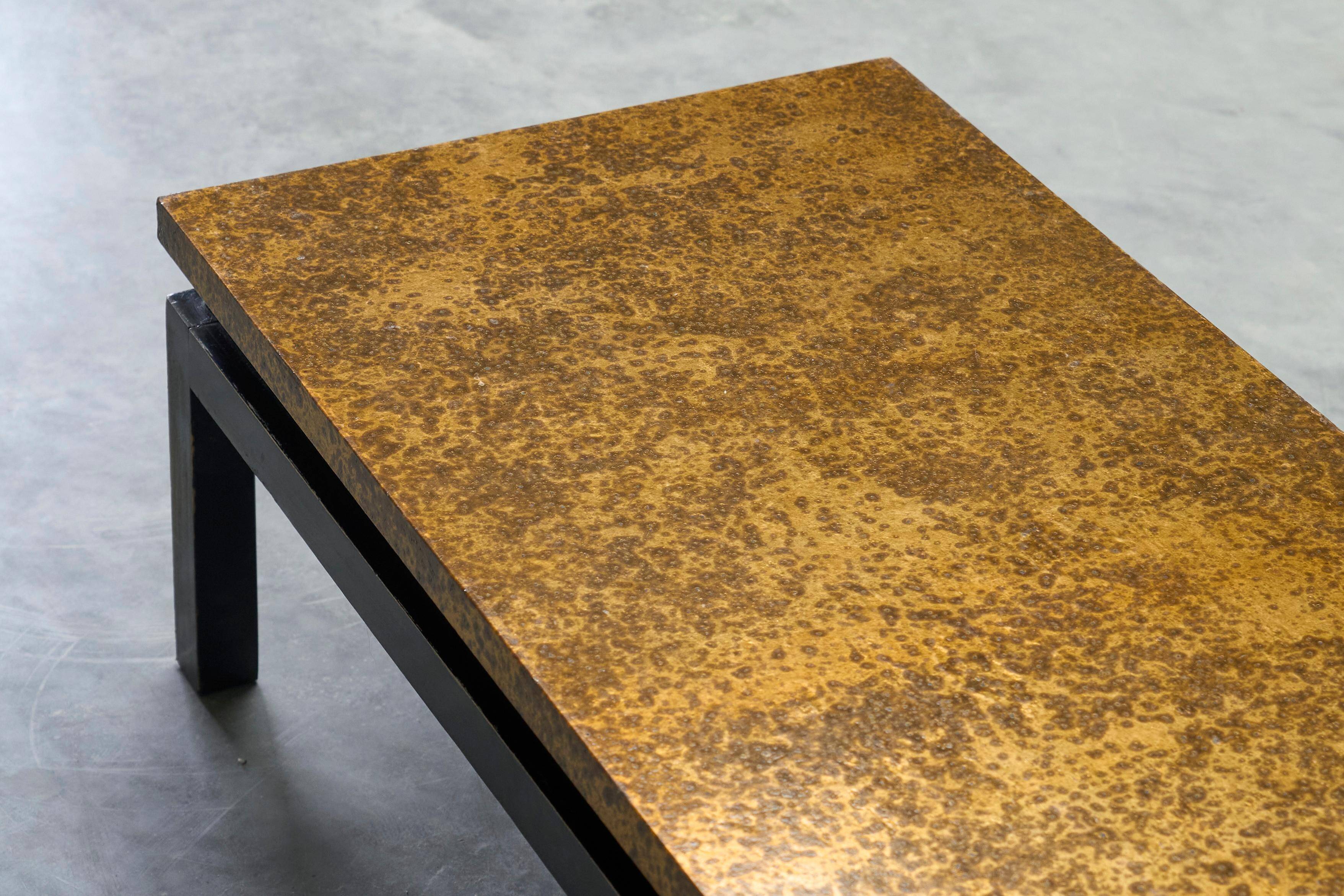 Modernist coffee table with a patinated gold top, 120x52.5x36 cm, mid-20th century.