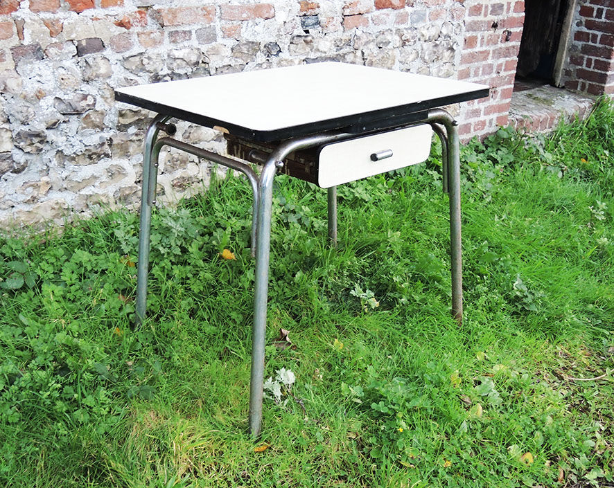 Old extendable table in yellow formica