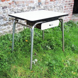 Old extendable table in yellow formica
