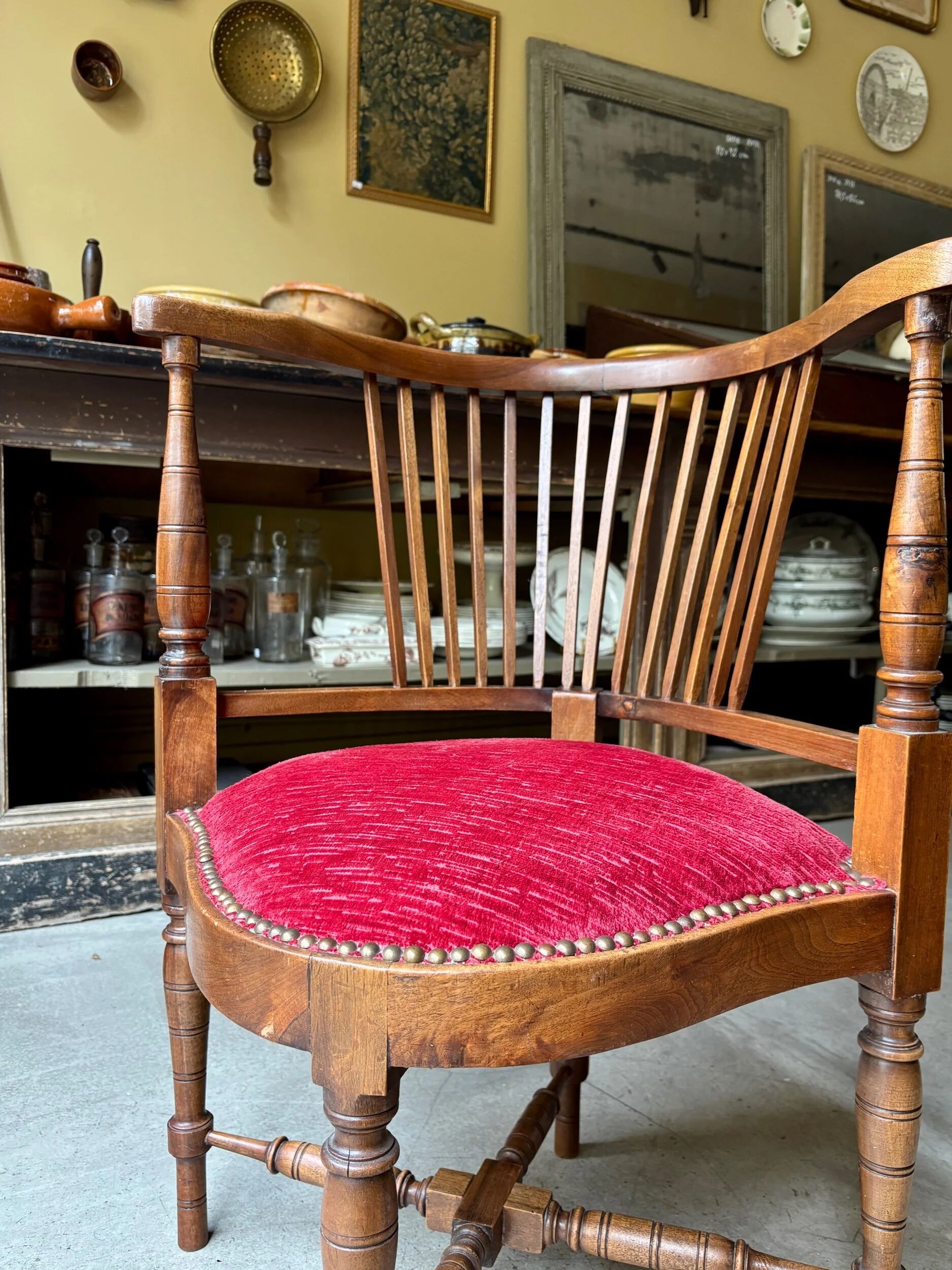 Corner armchair, dark wood and red velvet office chair.