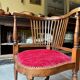 Corner armchair, dark wood and red velvet office chair.