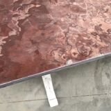 Large middle red speckled marble top table