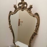 Miroir mural avec ornements dores patine