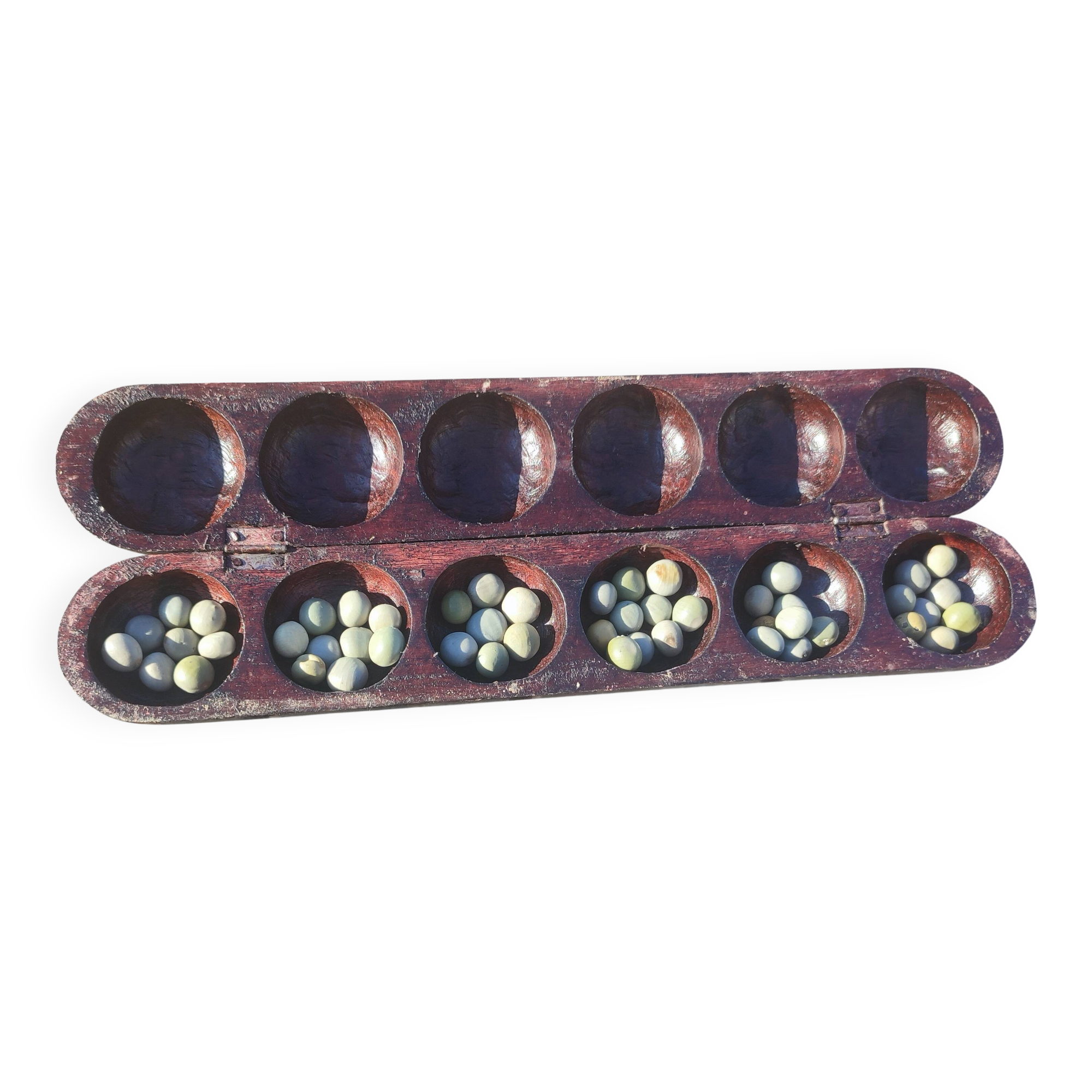 Traditional carved wooden Awalé game Mancala