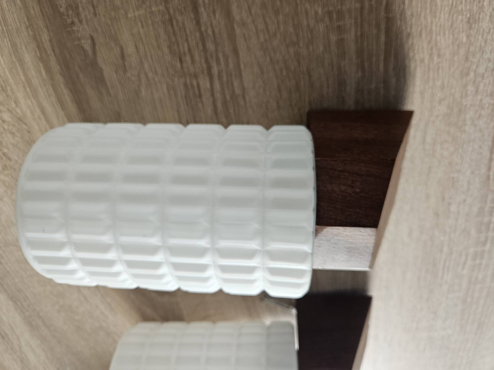 Philips wall sconces in wood and white opal.