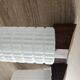 Philips wall sconces in wood and white opal.