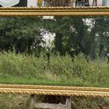Large beveled mirror in wood and gilded stucco