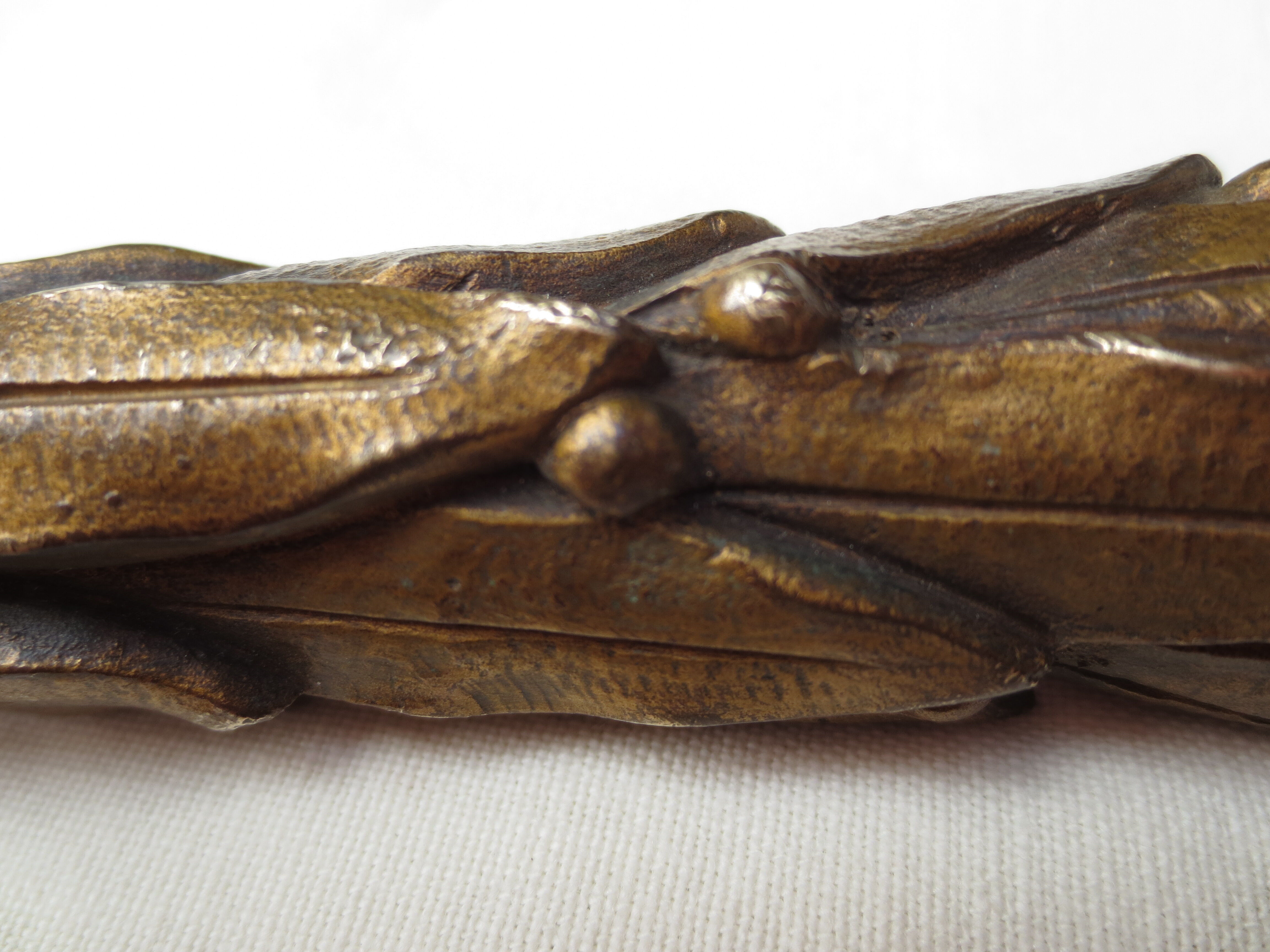 old bronze curved pediment