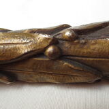 old bronze curved pediment