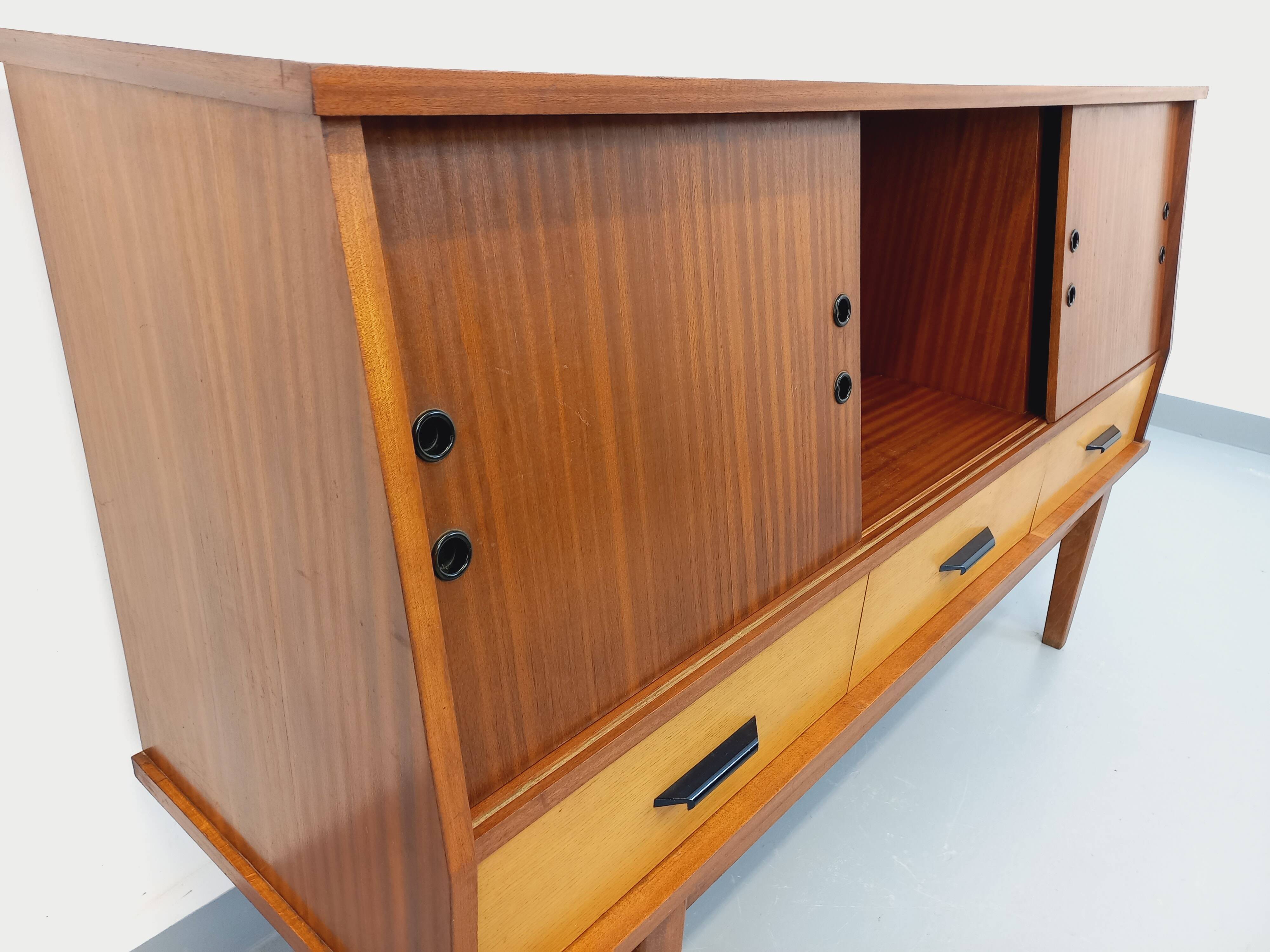 Vintage wooden enfilade in teak style from the 1960s.