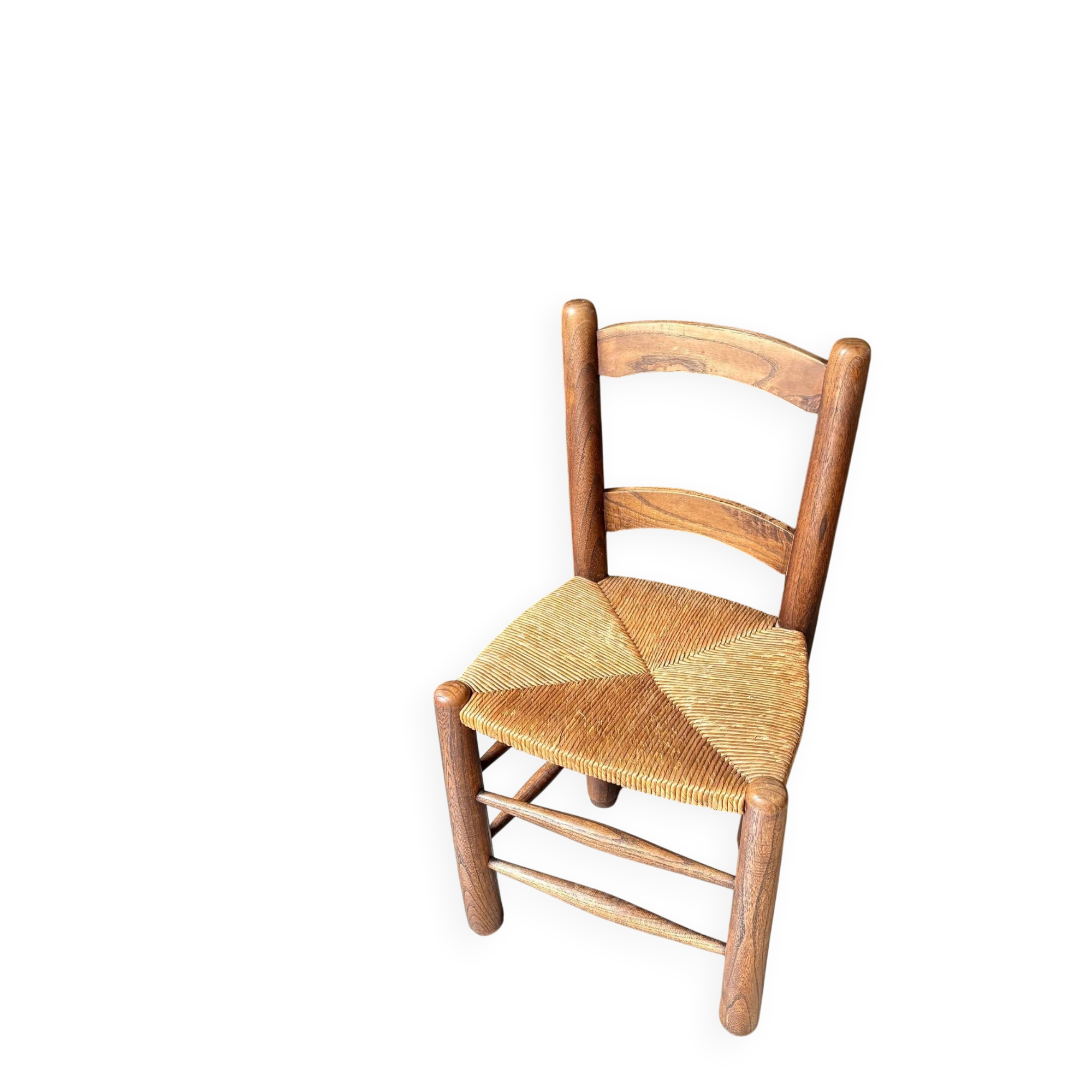 Provençal chair in dark wood and woven straw.