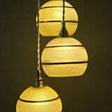 Suspension triple vintage glass globes in frosted yellow and gold.