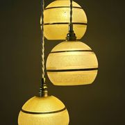 Suspension triple vintage glass globes in frosted yellow and gold.