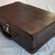 Small old suitcase with a ribbed appearance