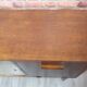 Renovated oak display cabinet with a bar on slanted legs