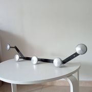 Vintage 1950s wall coat rack, wrought iron with chiselled details and solid aluminium.