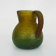 Pitcher in orange and green marble glass paste. Signed Georges De Feure for Daum