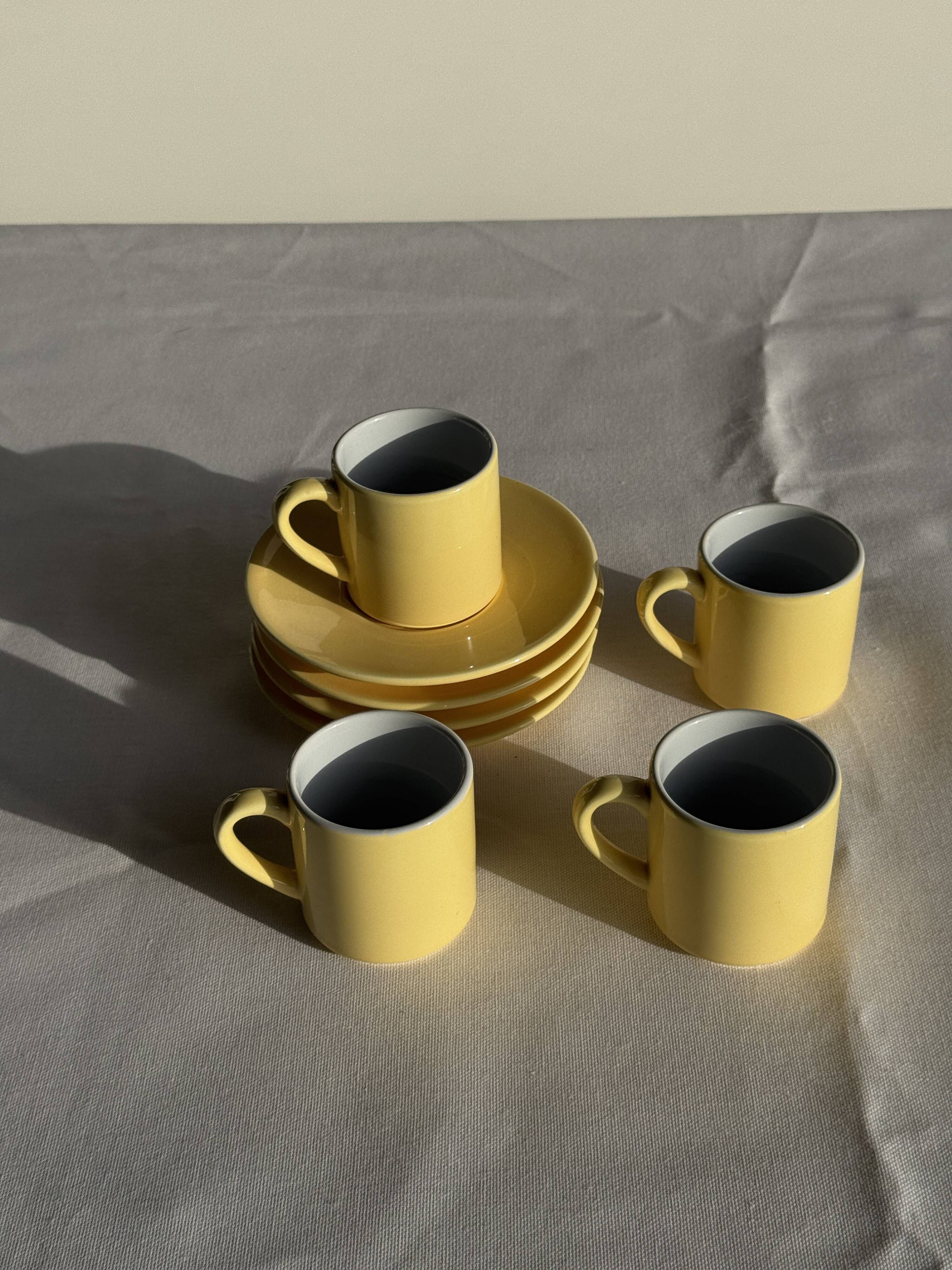 Set of 4 vintage yellow Italian espresso cups and saucers.