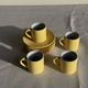Set of 4 vintage yellow Italian espresso cups and saucers.