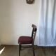 Set of 19 vintage wooden bistro chairs with red faux leather.