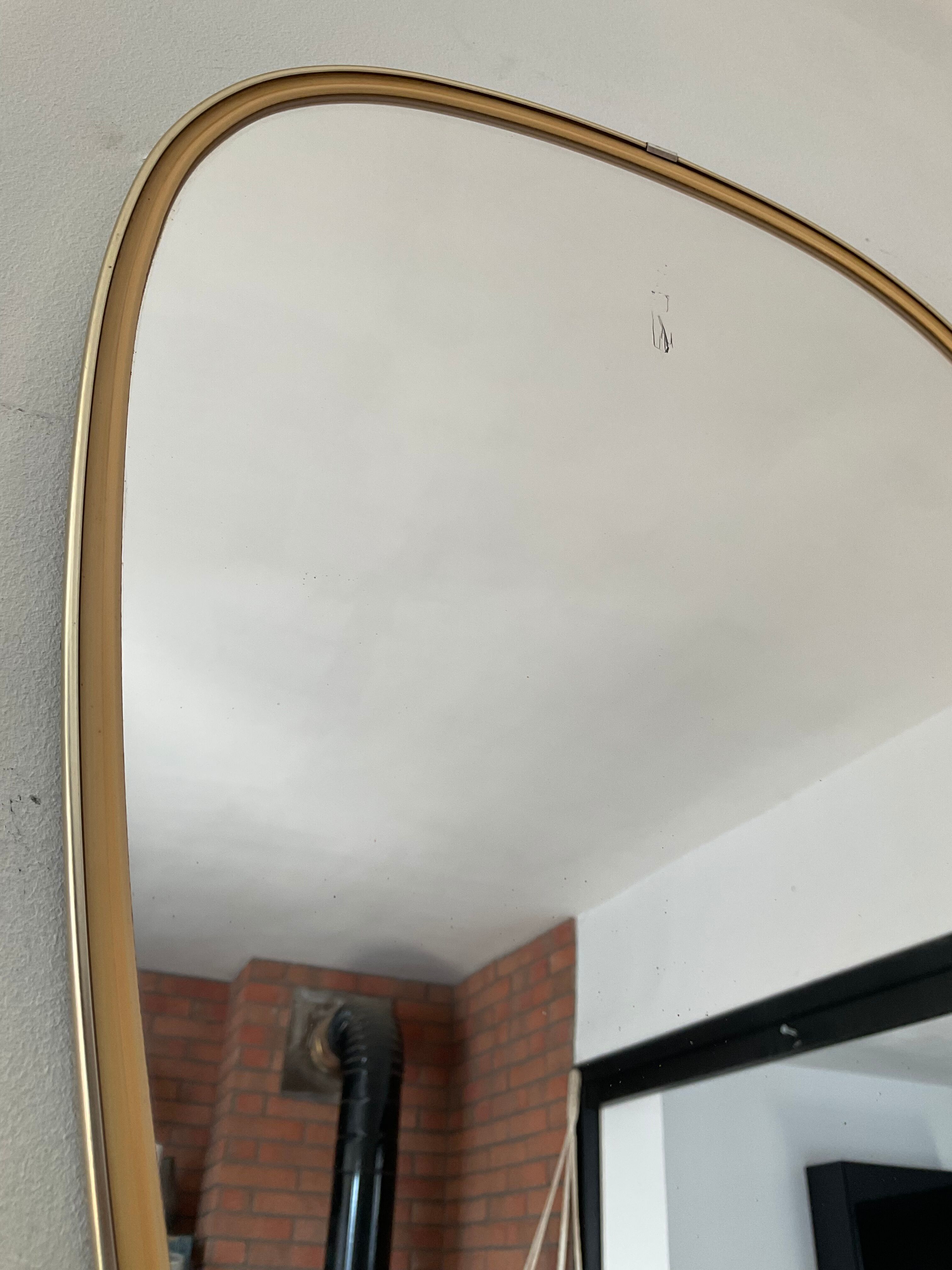 Free-form asymmetrical mirror from the 60s and 70s