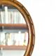 Antique oval mirror in carved wood