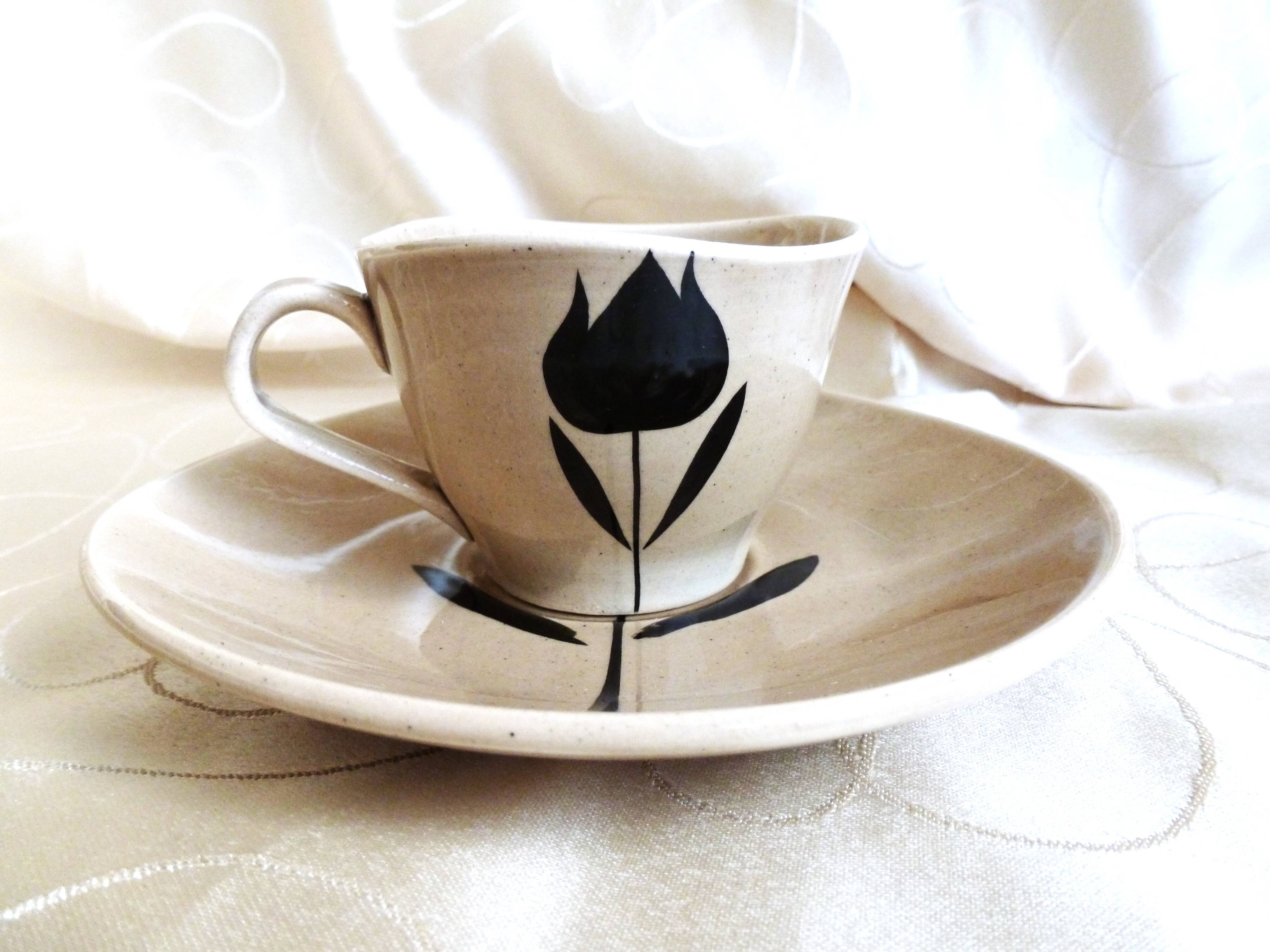 Vintage 23-piece Niderviller coffee set with hand-painted black tulip decor.